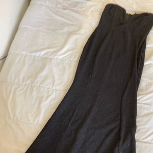 Sparkly black mermaid cut dress with a V cut on the front